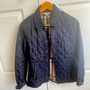 Women’s great condition navy blue Burberry fitted quilted jacket.